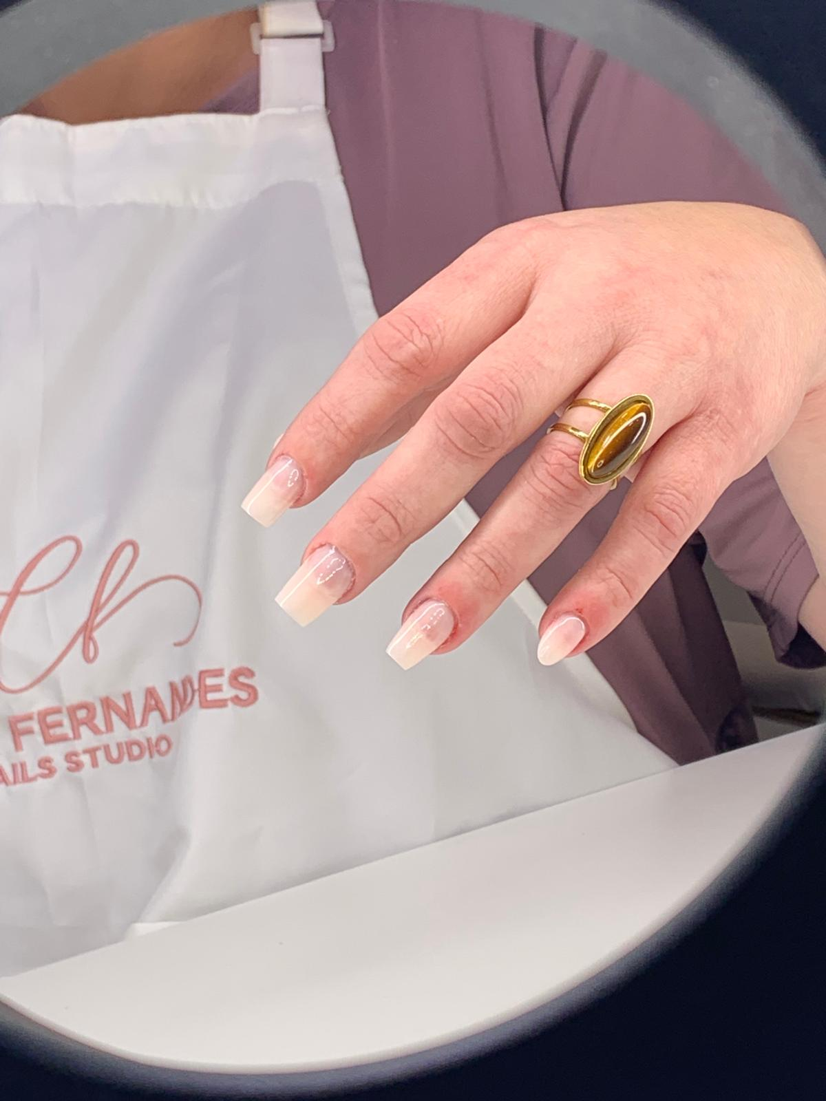 Nude ombre nails with Carla Fernandes Nail Studio apron