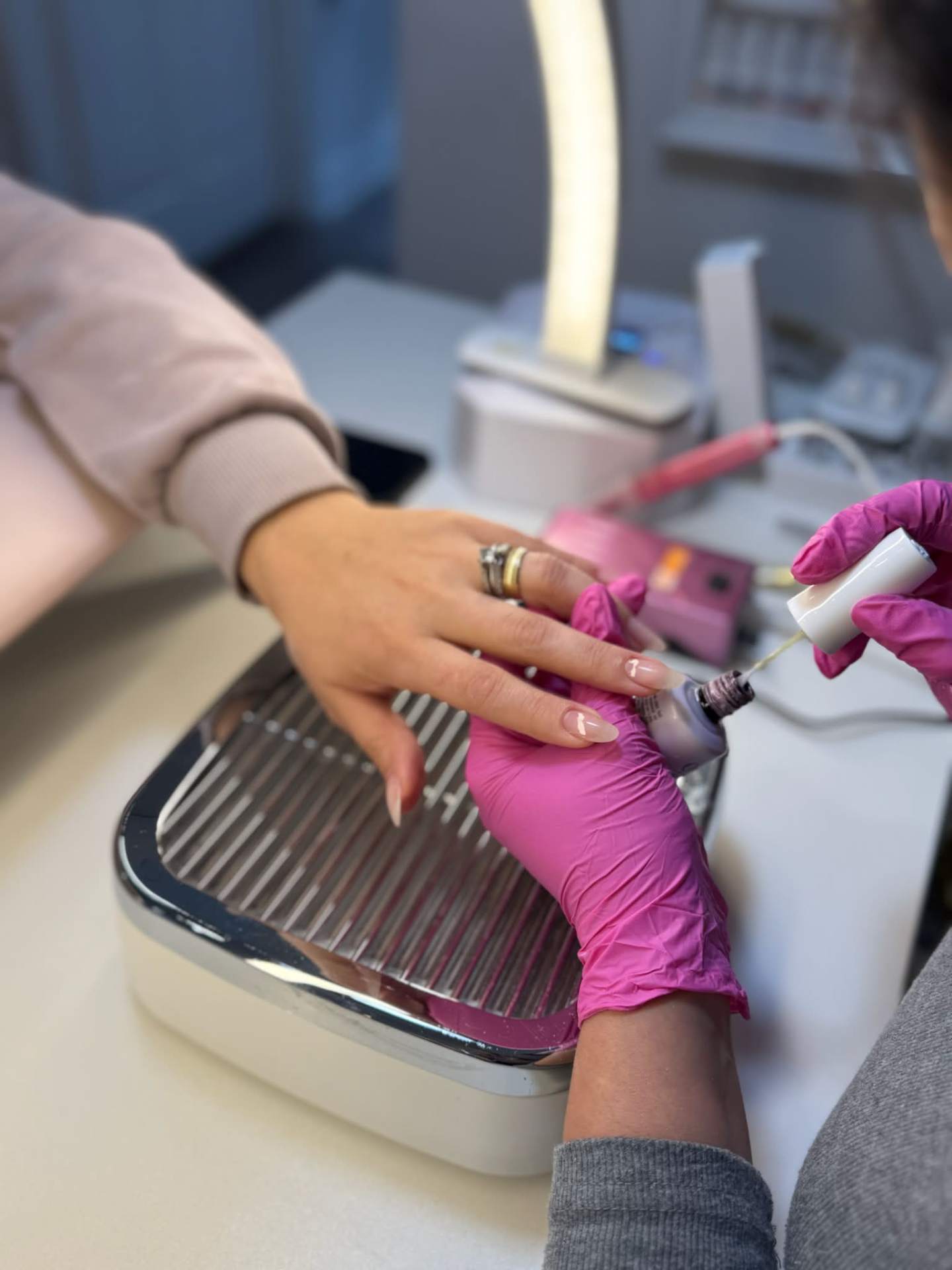 Carla applying gel polish at the studio
