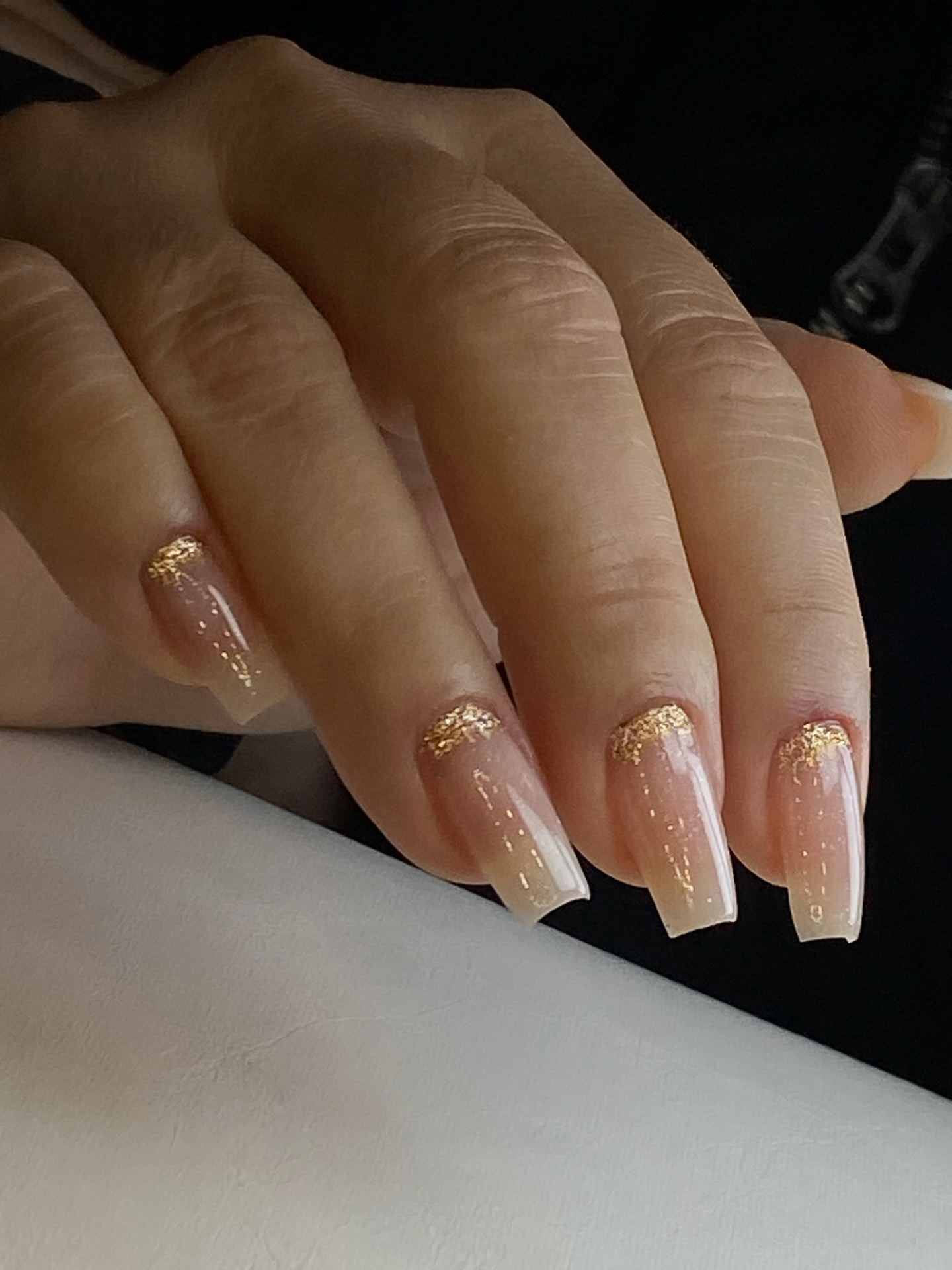 Nude nails with gold leaf accent