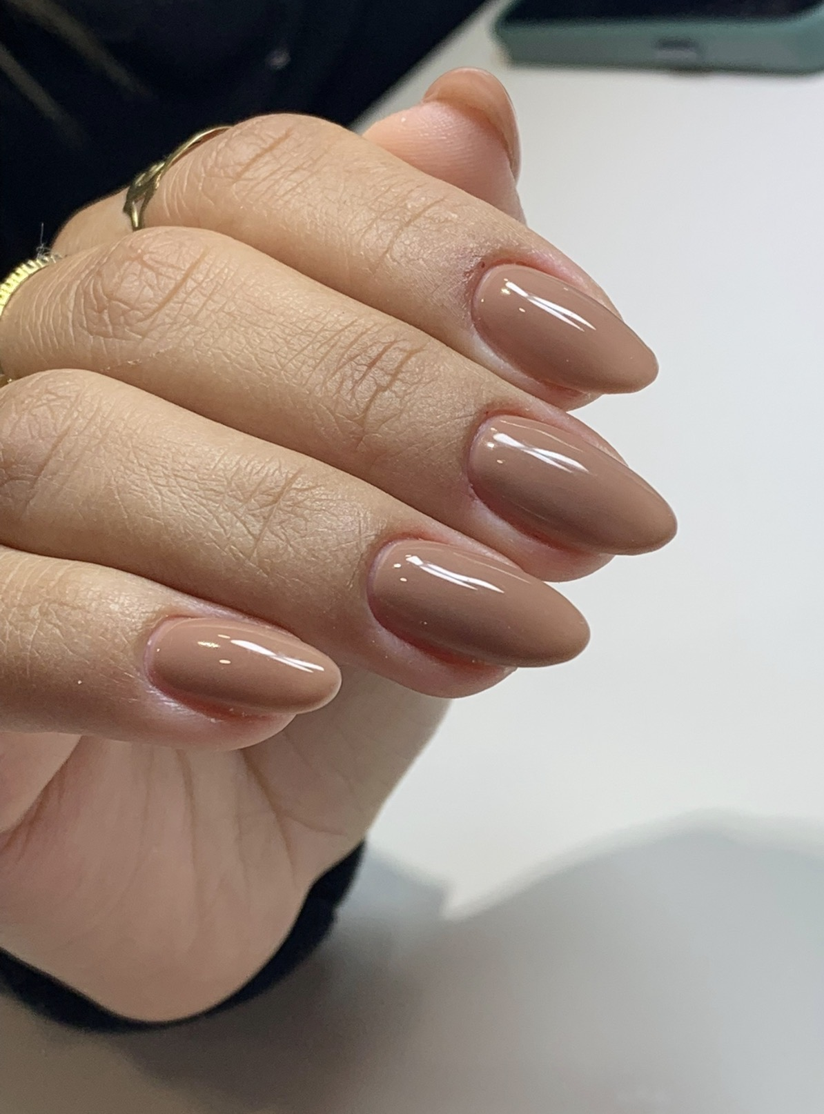 Glossy nude almond gel manicure