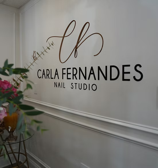 Carla Fernandes Nail Studio logo on the studio wall